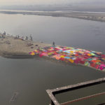 
              Washer men put their clothes out to dry on the banks of the River Yamuna as seen from a railway bridge near Agra, India, Saturday, Dec. 17, 2022. (AP Photo/Rajesh Kumar Singh)
            