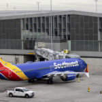 
              Southwest Airlines' aircraft parked on the tarmac of LaGuardia Airport, Tuesday, Dec. 27, 2022, in New York. The U.S. Department of Transportation says it will look into flight cancellations by Southwest Airlines that have left travelers stranded at airports across the country amid an intense winter storm.  (AP Photo/Yuki Iwamura)
            