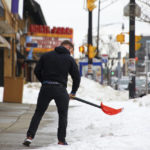 
              A person removes snow on Hertel Avenue a few days after a winter storm rolled through Western New York Thursday, Dec. 29, 2022, in Buffalo N.Y. (AP Photo/Jeffrey T. Barnes)
            