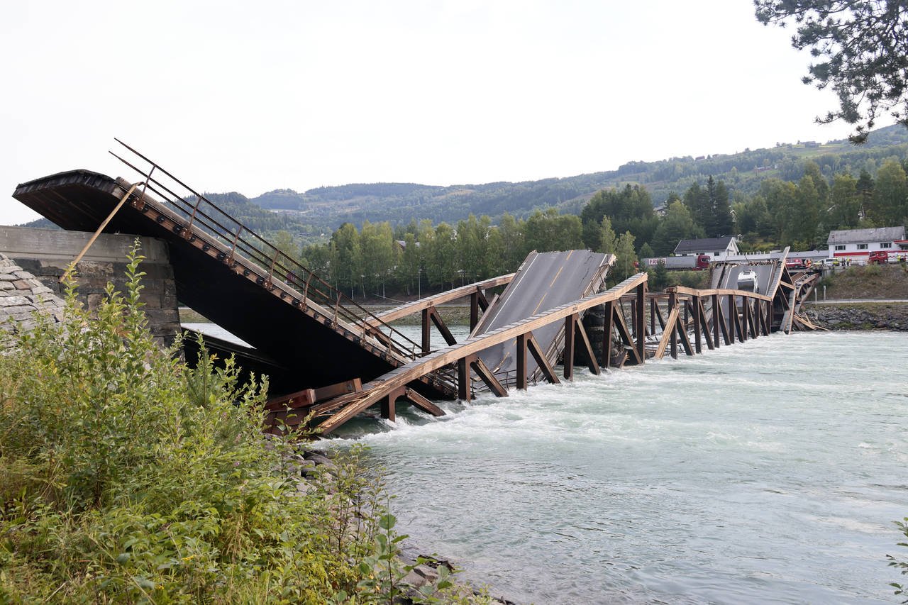 FILE - A view of a bridge that has collapsed over the River Laagen, in Gudbrandsdalen, Norway, Mond...