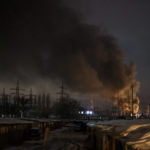 
              FILE - Smoke billows from a power infrastructure following a Russian drone attack in Kyiv region, Ukraine, Monday, Dec. 19, 2022. Russia's repeated attacks on Ukraine's energy infrastructure have left millions of civilians in the cold and the dark as temperatures plummet. (AP Photo/Felipe Dana, File)
            