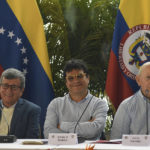 Pablo Beltran, left, representing the Colombian guerrilla National Liberation Army (ELN), Ivan Danilo Rueda, High Commissioner for Peace on behalf of the Colombian government, center, and Otty Pantino, of the Colombian government delegation, attend a press conference at the end the first part of peace talks at the Humboldt Hotel in Caracas, Venezuela, Monday, Dec. 12, 2022. (AP Photo/Matias Delacroix)