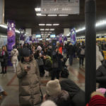 
              People rest in the subway station, being used as a bomb shelter during a rocket attack in Kyiv, Ukraine, Friday, Dec. 16, 2022. Ukrainian authorities reported explosions in at least three cities Friday, saying Russia has launched a major missile attack on energy facilities and infrastructure. Kyiv Mayor Vitali Klitschko reported explosions in at least four districts, urging residents to go to shelters. (AP Photo/Efrem Lukatsky)
            