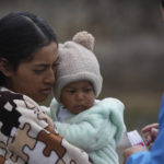 
              Marina, who did not want to give her last name, is given vitamins for her child from a Health Ministry worker who is going house to house in the Cotopaxi province of Ecuador, Friday, Dec. 2, 2022. Child malnutrition is chronic among Ecuador's 18 million inhabitants, hitting hardest in rural areas and among the country's Indigenous, according to Erwin Ronquillo, secretary of the government program Ecuador Grows Without Malnutrition. (AP Photo/Dolores Ochoa)
            