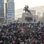 
              Protesters gather on Sukhbaatar Square in Ulaanbaatar in Mongolia on Monday, Dec. 5, 2022. Protesters angered by allegations of corruption linked to Mongolia's coal trade with China have stormed the State Palace in the capital, demanding dismissals of officials involved in the scandal. (AP Photo/Alexander Nikolskiy)
            