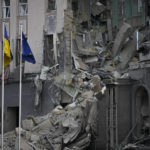 
              A damaged hotel at the scene of Russian shelling in Kyiv, Ukraine, Saturday, Dec. 31, 2022. (AP Photo/Efrem Lukatsky)
            