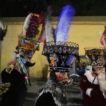 
              Mexican "chinelo" dancers participate in the procession of "Ninopan" during a Christmas "posada," which means lodging or shelter, in the Xochimilco borough of Mexico City, Wednesday, Dec. 21, 2022. For the past 400 years, residents have held posadas between Dec. 16 and 24, when they take statues of baby Jesus in procession to church for Mass to commemorate Mary and Joseph's cold and difficult journey from Nazareth to Bethlehem in search of shelter. (AP Photo/Eduardo Verdugo)
            