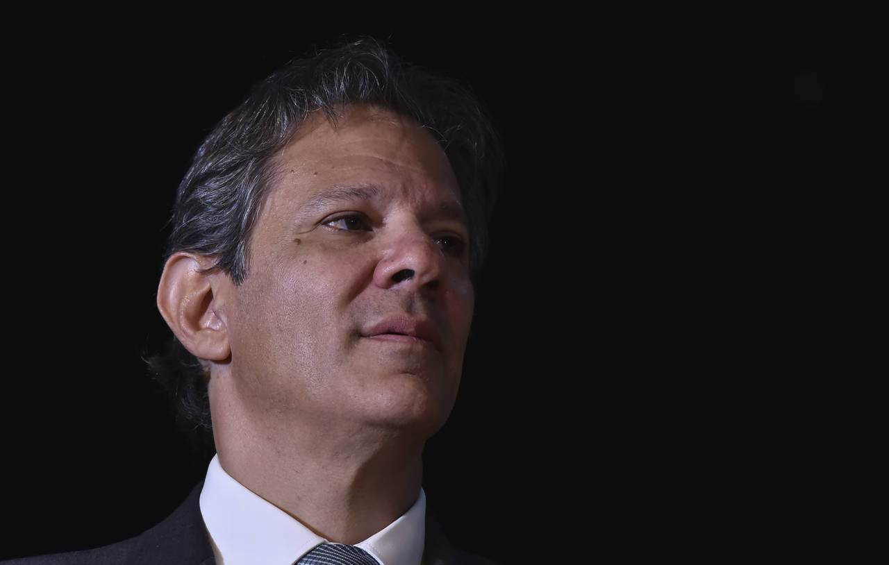 Former Sao Paulo Mayor Fernando Haddad listens to Brazil's President-elect Luiz Inacio Lula da Silv...