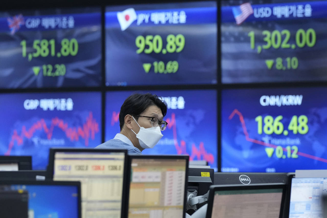 A currency trader works at the foreign exchange dealing room of the KEB Hana Bank headquarters in S...