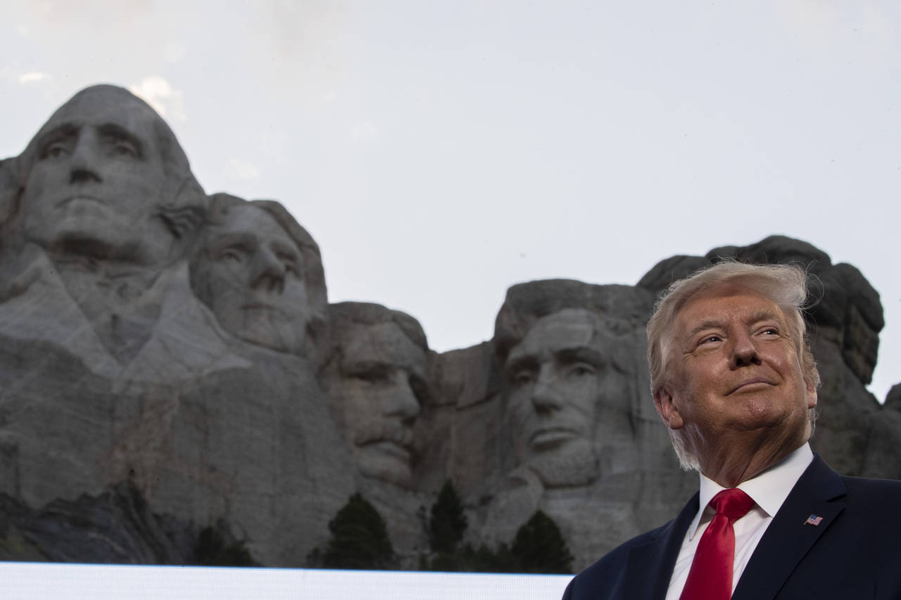 FILE - Then-President Donald Trump stands at Mount Rushmore National Memorial on  July 3, 2020, nea...