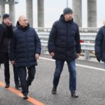 
              Russian President Vladimir Putin, third right, listens to Deputy Prime Minister Marat Khusnullin, left, as he visits the Crimean Bridge connecting Russian mainland and Crimean peninsula over the Kerch Strait, which was damaged by a truck bomb attack in October, after restoration works, not far from Kerch, Crimea, Monday, Dec. 5, 2022. (Mikhail Metzel, Sputnik, Kremlin Pool Photo via AP)
            