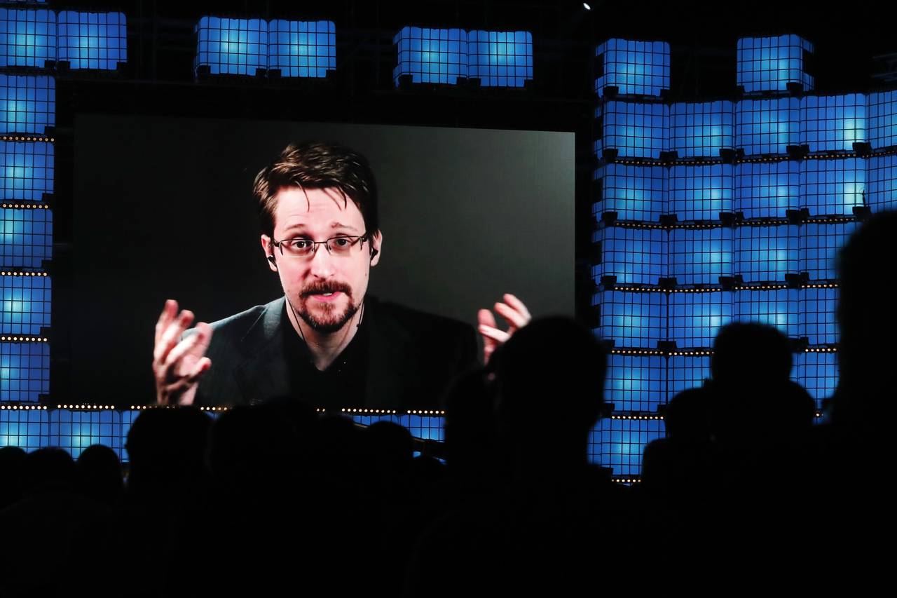 FILE - Former U.S. National Security Agency contractor Edward Snowden addresses attendees through v...