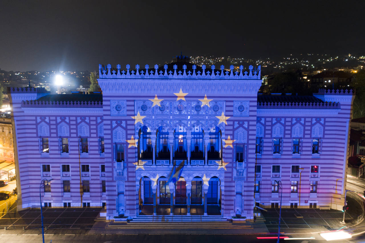 FILE - The European Union flag is projected on the National Library building in Sarajevo, Bosnia, o...