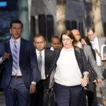 
              Ramesh "Sunny" Balwani, second from left, the former lover and business partner of Theranos CEO Elizabeth Holmes, arrives at federal court in San Jose, Calif., Wednesday, Dec. 7, 2022. (AP Photo/Jeff Chiu)
            