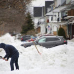 
              A person removes snow from the front of his driveway a few days after a winter storm rolled through western New York Thursday, Dec. 29, 2022, in Buffalo N.Y. (AP Photo/Jeffrey T. Barnes)
            
