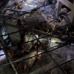 
              Following the burst of a huge aquarium, the atrium of a hotel is devastated in Berlin Germany, Friday, Dec. 16, 2022. German police say a huge aquarium in the center of Berlin has burst, causing a wave of devastation in and around the Sea Life tourist attraction. The words in Hebrew reads: 'The Aquarium exploded'. (instagram/tnn/dpa via AP)
            