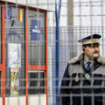 
              FILE - A Romanian border police officer stands guard at the railway border crossing point between Romania and Moldova in Ungheni, Romania, on Jan. 18, 2011. European Union countries will weigh on Thursday, Dec. 8, 2022, whether the bloc's three newest members — Bulgaria, Romania, and Croatia — can fully open their borders and participate in Europe's ID check-free travel zone, but more delays to their entry appear likely. (AP Photo/Vadim Ghirda, File)
            