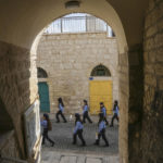 
              Girls scouts march during Christmas parade towards the Church of the Nativity, traditionally believed to be the birthplace of Jesus Christ, in the West Bank town of Bethlehem, Saturday , Dec. 24, 2022. (AP Photo/Mahmoud Illean)
            