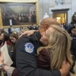 
              U.S. Capitol Police officer Sgt. Harry Dunn, left, hugs Rep. Abigail Spanberger, D-Va., after a Congressional Gold Medal ceremony honoring law enforcement officers who defended the U.S. Capitol on Jan. 6, 2021, in the U.S. Capitol Rotunda in Washington, Tuesday, Dec. 6, 2022. (AP Photo/Alex Brandon)
            