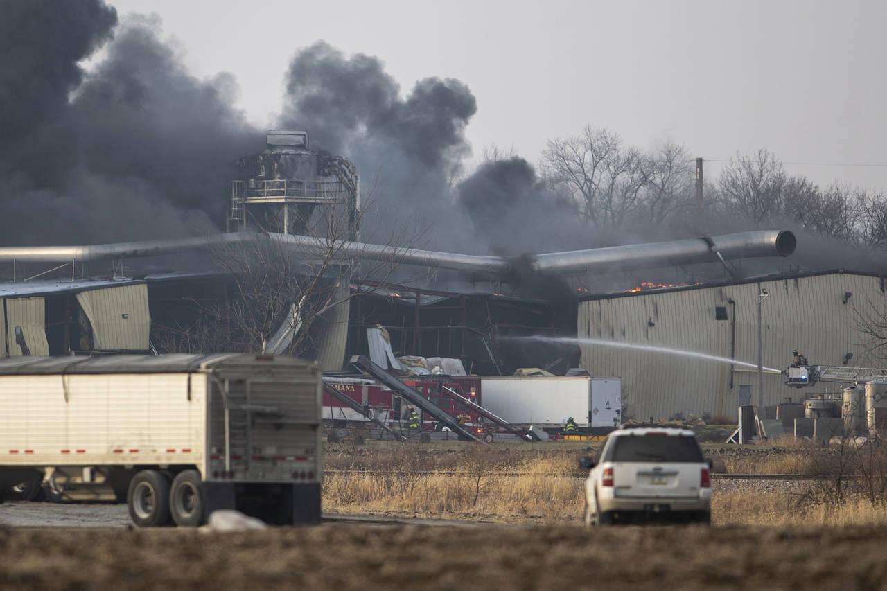FILE - Firefighters work to control a blaze at a grain elevator, Thursday, Dec. 8, 2022, in Marengo...