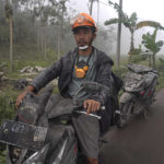 
              Villagers' motorbikes are seen covered in volcanic ash from the eruption of Mount Semeru in Lumajang, East Java, Indonesia, Monday, Dec. 5, 2022. Improved weather conditions Monday allowed rescuers to resume evacuation efforts and a search for possible victims after the highest volcano on Indonesia's most densely populated island erupted, triggered by monsoon rains. (AP Photo/Dicky Bisinglasi)
            