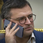 
              Ukraine's Foreign Minister Dmytro Kuleba talks over the phone before an interview with The Associated Press in Kyiv, Ukraine, Monday, Dec. 26, 2022. (AP Photo/Efrem Lukatsky)
            
