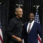 
              Former President Barack Obama, left, greets Sen. Raphael Warnock, D-Ga., right, before Obama speaks during a rally on Thursday, Dec. 1, 2022, in Atlanta. Warnock is running against Republican Herschel Walker in a runoff election. (AP Photo/Brynn Anderson)
            