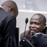 
              Dominic Ongwen sits in the court room to listen to the judgment of the Appeals Chamber of the International Criminal Court on the Defence's appeals against his conviction and sentence in The Hague, Netherlands, Thursday, Dec. 15, 2022. Ongwen was a senior commander in the Lord's Resistance Army and is currently serving a 25-year sentence for dozens of war crimes and crimes against humanity. (Sem van der Wal/Pool Photo via AP)
            