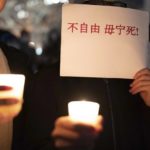 
              A person holds a sign as demonstrators gather at Freedom Plaza in Washington, Sunday, Dec. 4, 2022, to protest in solidarity with the ongoing protests against the Chinese government's continued zero-COVID policies. (AP Photo/Jose Luis Magana)
            