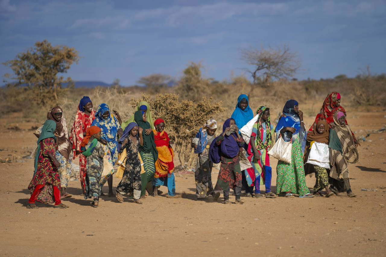 FILE - People arrive at a displacement camp on the outskirts of Dollow, Somalia, on Sept. 19, 2022....