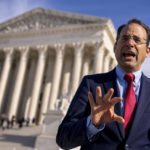 
              Colorado Attorney General Phil Weiser walks out of the Supreme Court in Washington, Monday, Dec. 5, 2022, after the Court heard the case 303 Creative LLC v. Elenis. The Supreme Court is hearing the case of a Christian graphic artist who objects to designing wedding websites for gay couples, that's the latest clash of religion and gay rights to land at the highest court. (AP Photo/Andrew Harnik)
            