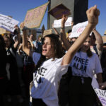 
              FILE - Demonstrators participate in a protest against fossil fuels at the COP27 U.N. Climate Summit, Friday, Nov. 18, 2022, in Sharm el-Sheikh, Egypt. U.S. climate envoy John Kerry said the international global warming talks didn’t do enough to speed up cuts in emissions of heat-trapping gases. (AP Photo/Peter Dejong, File)
            