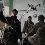 
              An injured Ukrainian soldier receives first aid at a hospital in Donetsk region, Ukraine, Monday, Dec. 19, 2022. (AP Photo/LIBKOS)
            