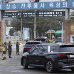 
              A convoy of vehicles, one of them carrying K-pop band BTS's member Jin arrive at an army training center in Yeoncheon, South Korea, Tuesday, Dec. 13, 2022. Jin was set to enter a frontline South Korean boot camp Tuesday to start his 18 months of mandatory military service, as fans gathered near the base to say goodbye to their star. (AP Photo/Ahn Young-joon)
            