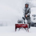 
              Francisco Erazo uses his snow blower to clear snow on Friday, Dec. 23, 2022 in Grand Rapids, Mich.  A blizzard warning is in effect for Kent County and the surrounding region. Winter weather is blanketing the U.S. as a massive storm sent temperatures crashing and created whiteout conditions. (Neil Blake/The Grand Rapids Press via AP)
            