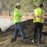 
              In this photo provided by Shawna Garcia, monitors working with the Wintu Tribe of Northern California search for remains and artifacts at a construction site on Nov. 30, 2022, where a trail and parking area along the Sacramento River will soon open in Redding, Calif. Ancestors of the tribe were buried near the site, but the tribe says it didn't receive proper notification about construction plans from the federal agency running the project. (Shawna Garcia via AP)
            