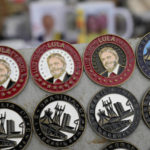 
              Souvenir inaugural pins with the image of Brazilian President-elect Luiz Inacio Lula da Silva are displayed for sale in Brasilia, Brazil, Dec. 31, 2022, at the Esplanade of Ministries where his inauguration ceremony will take place on Jan. 1, 2023, as the country's new leader. (AP Photo/Eraldo Peres, File)
            