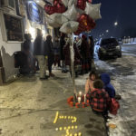 
              Supporters of Howard Johnson, 24, who was fatally shot by police in St. Paul, Minn., on Monday, held a vigil at the shooting scene on Tuesday night, Dec. 6, 2022. (Gabrielle Lombard/Pioneer Press via AP)
            
