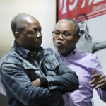 
              Peter Lyoya listens to his family interpreter as he looks at video of his son's shooting during a news conference, Wednesday, Dec. 7, 2022, in Detroit. The family of Patrick Lyoya, a Black motorist fatally shot by a white police officer in Grand Rapids, Mich., filed a lawsuit Wednesday in federal court against the now-former officer and the city of Grand Rapids. The civil rights suit on behalf of Lyoya's family alleges unnecessary, illegal and excessive force and gross negligence by then-Officer Christopher Schurr. (AP Photo/Carlos Osorio)
            