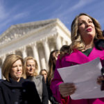 
              Lorie Smith, a Christian graphic artist and website designer in Colorado, right, accompanied by her lawyer, Kristen Waggoner of the Alliance Defending Freedom, second from left, speaks outside the Supreme Court in Washington, Monday, Dec. 5, 2022, after her case was heard before the Supreme Court. The Supreme Court is hearing the case of Smith, who objects to designing wedding websites for gay couples, that's the latest clash of religion and gay rights to land at the highest court. (AP Photo/Andrew Harnik)
            