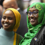 State Reps. Mana Abdi, D-Lewiston, left, and Deqa Dhalac, D-South Portland, attend their first session of the Maine Legislature, Wednesday, Dec. 7, 2022, in Augusta, Maine. They are the first Somali-Americans elected to the Maine Legislature. (AP Photo/Robert F. Bukaty)