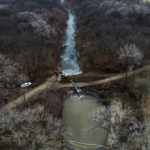 
              In this photo taken by a drone, cleanup continues in the area where the ruptured Keystone pipeline dumped oil into a creek in Washington County, Kan., Friday, Dec. 9, 2022. (DroneBase via AP)
            