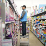 
              File - An employee stocks shelves in the toy section of a Walmart in Secaucus, N.J., Tuesday, Nov. 22, 2022. More than two and a half years into the pandemic, many businesses haven't been able to resume the same hours of operations or services as they continue to grapple with worker shortages. (AP Photo/Seth Wenig, File)
            