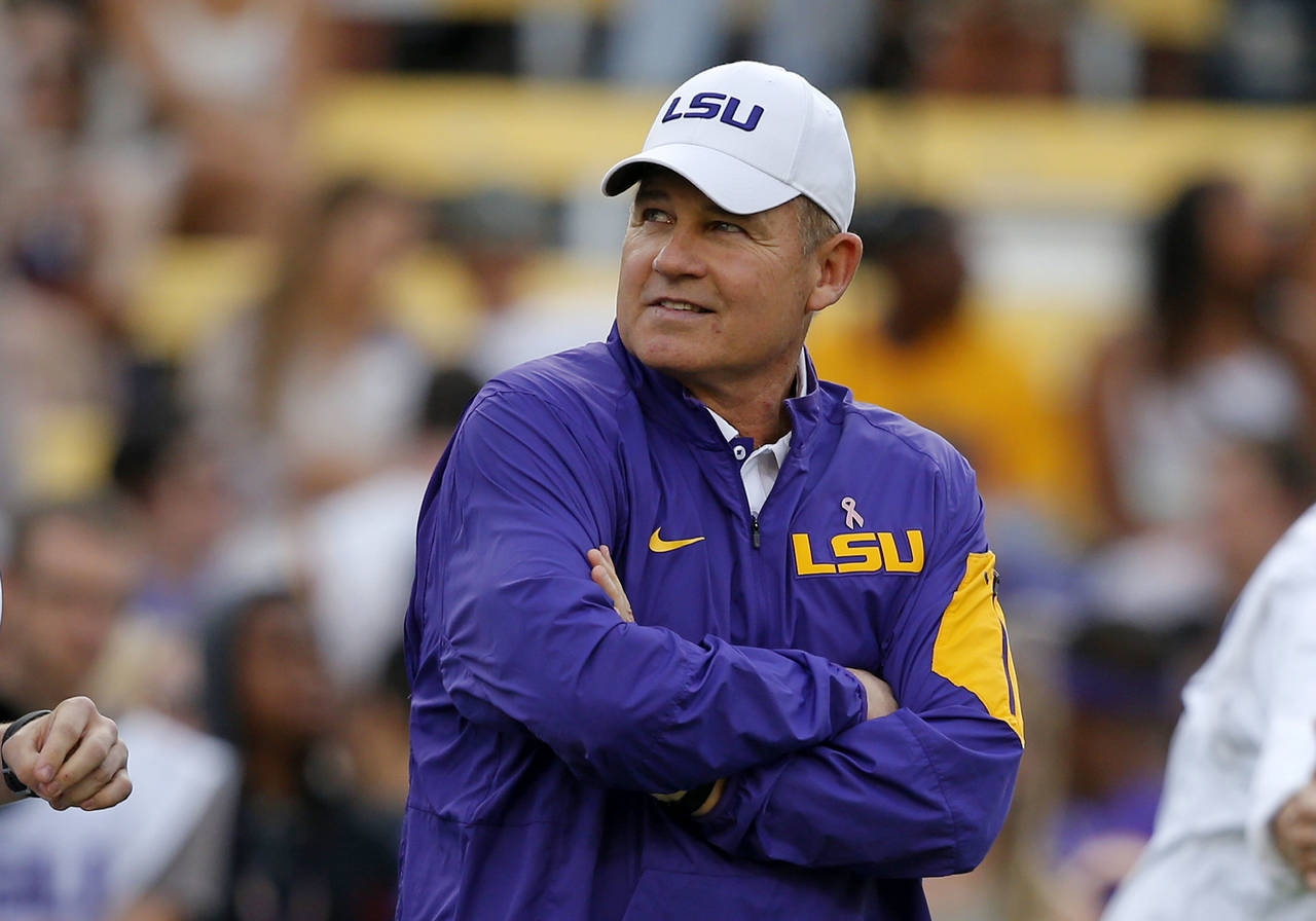 FILE - In this Oct. 17, 2015, file photo, LSU coach Les Miles watches his team warm up before an NC...