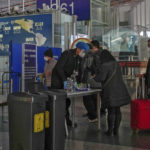 
              Passenger wearing face masks line up for security check before entering an international departure gate at the Beijing Capital International Airport in Beijing, Thursday, Dec. 29, 2022. Moves by the U.S., Japan and others to mandate COVID-19 tests for passengers arriving from China reflect global concern that new variants could emerge in its ongoing explosive outbreak — and the government may not inform the rest of the world quickly enough. (AP Photo/Andy Wong)
            