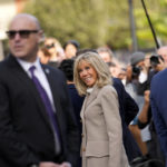 
              Brigitte Macron, wife of French President Emmanuel Macron, smiles as they arrive at Jackson Square in New Orleans, Friday, Dec. 2, 2022. (AP Photo/Gerald Herbert)
            