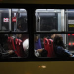 
              A woman peers from a bus window late at night in Ecatepec, State of Mexico, Mexico, Sunday, July 22, 2022.  The State of Mexico ranks 10th among the country’s 32 states in femicides per 100,000 women. Dilcya García, who leads the Mexico state prosecutor’s office on gender violence, said the issue is part of the cement of Mexico’s social structure. (AP Photo/Eduardo Verdugo)
            