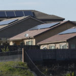 
              FILE - Solar panels on rooftops of a housing development in Folsom, Calif., on Feb. 12, 2020. California utility regulators will consider a proposal on Thursday, Dec. 15, 2022, to remake financial incentives for people who install rooftop solar panels on their homes. (AP Photo/Rich Pedroncelli, File)
            