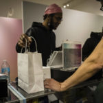 
              A person purchases cannabis products at Housing Works Cannabis Co., New York's first legal cannabis dispensary at 750 Broadway in Noho on Thursday, Dec. 29, 2022, in New York. (AP Photo/Stefan Jeremiah)
            