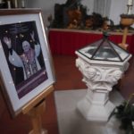 
              A picture of Pope emeritus Benedict XVI is placed besides a baptistery in the St. Oswald church in Marktl, Germany, Thursday, Dec. 29, 2022. The health of Pope Emeritus Benedict XVI has worsened due to his age, and doctors are constantly monitoring the 95-year-old's condition, the Vatican said Wednesday. (AP Photo/Matthias Schrader)
            